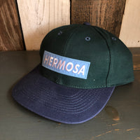 Hermosa Beach BLUE SUPREME HERMOSA - 6 Panel Low Profile Baseball Cap with Adjustable Strap with Press Buckle - Dark Green/Navy