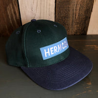 Hermosa Beach BLUE SUPREME HERMOSA - 6 Panel Low Profile Baseball Cap with Adjustable Strap with Press Buckle - Dark Green/Navy